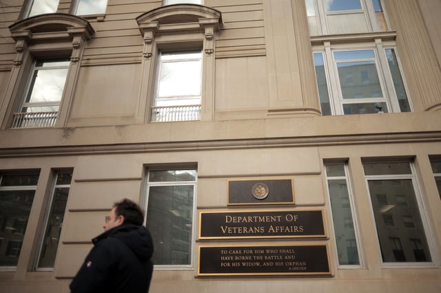 A person walks past the Department of Veterans Affairs headquarters a block from the White House on March 6, 2025 in Washington, DC.