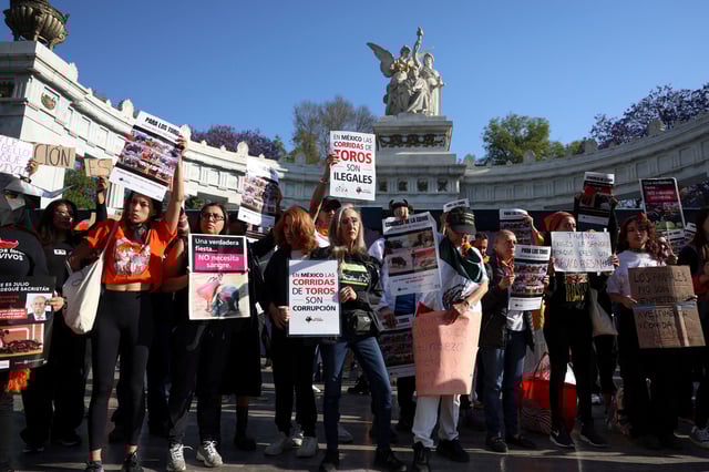 Demonstrators protest against bullfighting in front of the Benito Juarez Hemicycle monument, in Mexico City, Mexico March 18, 2025. REUTERS/Raquel Cunha