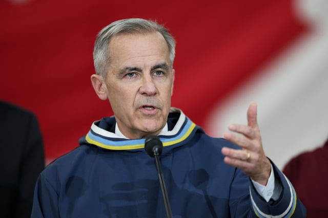 Canada's Prime Minister Mark Carney gives a statement following a meeting with Nunavut Premier P.J. Akeeagok, at a Forward Operating Location in Iqaluit, Nunavut, Canada, March 18, 2025.  REUTERS/Carlos Osorio