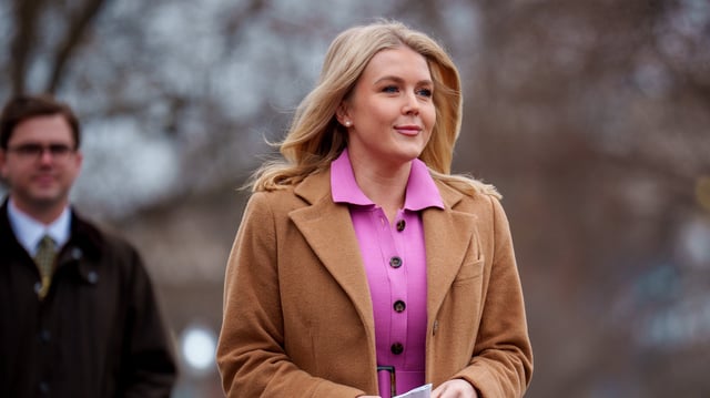 White House press secretary Karoline Leavitt walks towards the West Wing after a television interview on March 14, 2025 in Washington, DC.