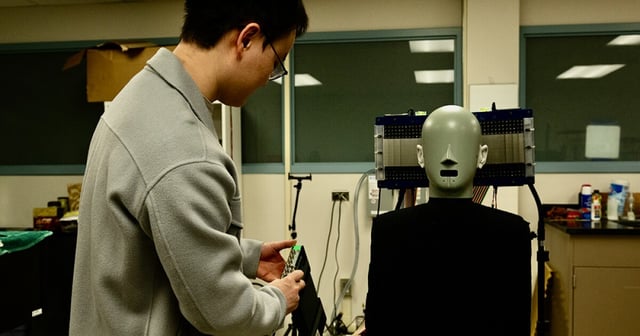 Postdoctoral scholar Jia-Xin "Jay" Zhong prepares to test the "audible enclave" technology on a mannequin