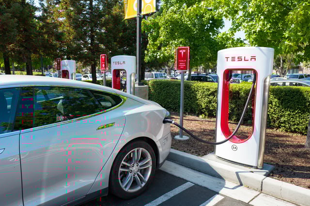 Tesla automobile plugged in and charging a Supercharger rapid battery charging station for the electric vehicle company Tesla Motors, in the Silicon Valley town of Mountain View, California, August 24, 2016.