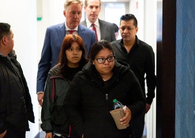 Fabiola Pacheco Delacruz, front, the mother of Zulma Daniela Calderon Pacheco, arrives with other family members, March 18, 2025, at the offices of Cavanagh Sorich Law Group where her family announced a lawsuit against Mansion Live and security guard charged in her death. Calderon Pacheco was shot and killed in the Stone Park nightclub on March 8. (Brian Cassella/Chicago Tribune)