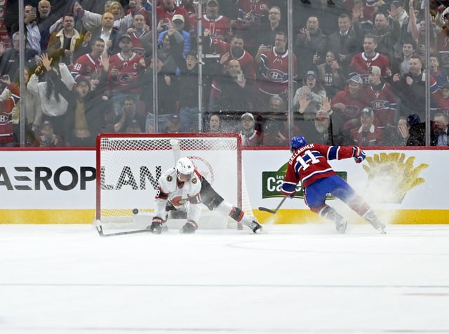 Mar 18, 2025; Montreal, Quebec, CAN; Montreal Canadiens forward Brendan Gallagher (11) scores an empty net goal and Ottawa Senators forward Tim Stutzle (18) attempts to defend during the third period at the Bell Centre. Mandatory Credit: Eric Bolte-Imagn Images