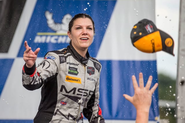 Legge throws a hat to fans after a Michelin GT Challenge IMSA WeatherTech Series race in Alton, Virginia, in 2018.