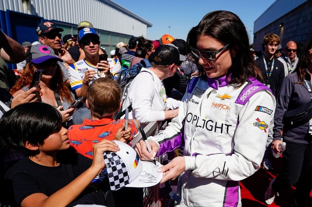 Legge signs autographs before the start of the race on March 9.