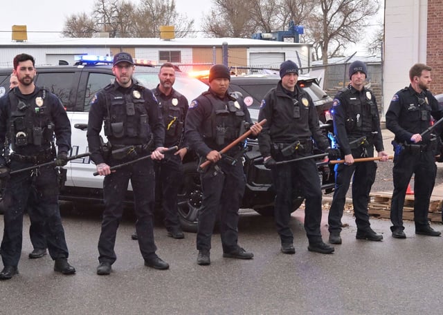 Aurora police arrive at a protest against ICE's detention of activist Jeanette Vizguerra, outside the GEO Aurora ICE Processing Center in Aurora, Colorado, on Tuesday.