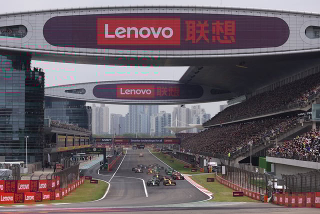 Lewis Hamilton of Great Britain driving the (44) Mercedes AMG Petronas F1 Team W15 and Lando Norris of Great Britain driving the (4) McLaren MCL38 Mercedes lead the field into turn one at the start of the Sprint ahead of the F1 Grand Prix of China at Shanghai International Circuit on April 20, 2024 in Shanghai, China.