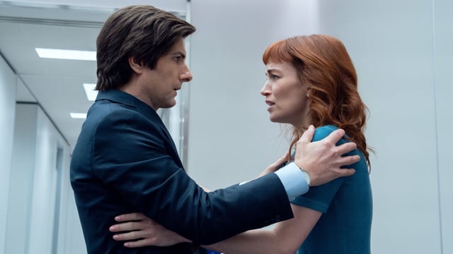 Mark and Helly hold each other in Severance.