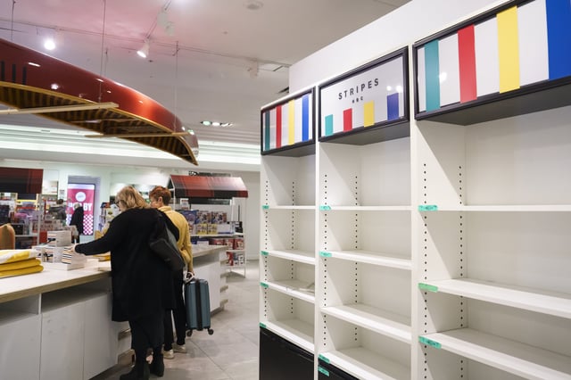 Shoppers browse a Hudson's Bay in Toronto on Monday, March 17, 2025. 