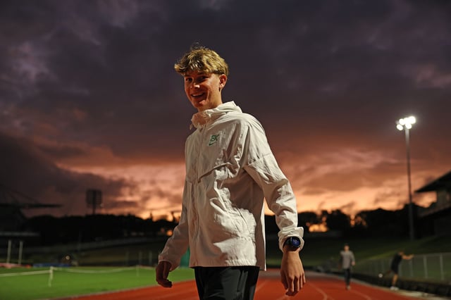 New Zealand middle distance runner Sam Ruthe warms up before running in the mile distance at Mt Smart Stadium on March 19, 2025 in Auckland, New Zealand. Ruthe broke the four minute mile barrier with a time of 3:58.35 placing him as the youngest person in history and first under 15 years old to break the record.