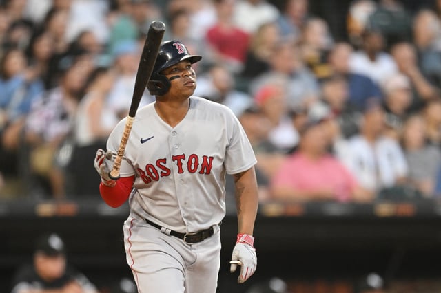 CHICAGO, ILLINOIS - JUNE 23: Rafael Devers #11 of the Boston Red Sox tosses his bat after hitting a two-run home run in the fourth inning against the Chicago White Sox at Guaranteed Rate Field on June 23, 2023 in Chicago, Illinois.