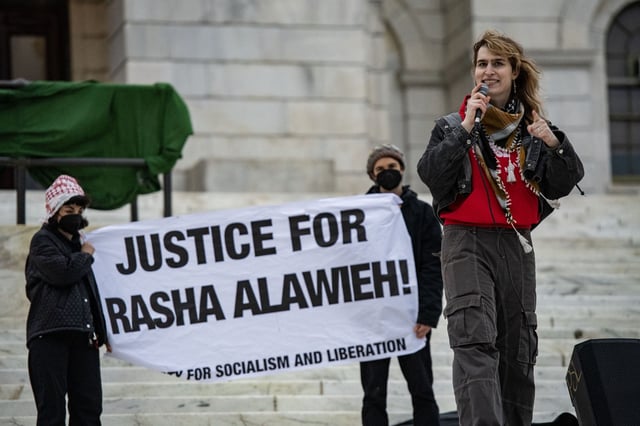 Maya Lehrer, organizer with the party for socialism and liberation, speaks during a protest against the deportation of Assistant Professor of Medicine Dr. Rasha Alawieh of Brown University at the State House in Providence, Rhode Island, on March 17, 2025.