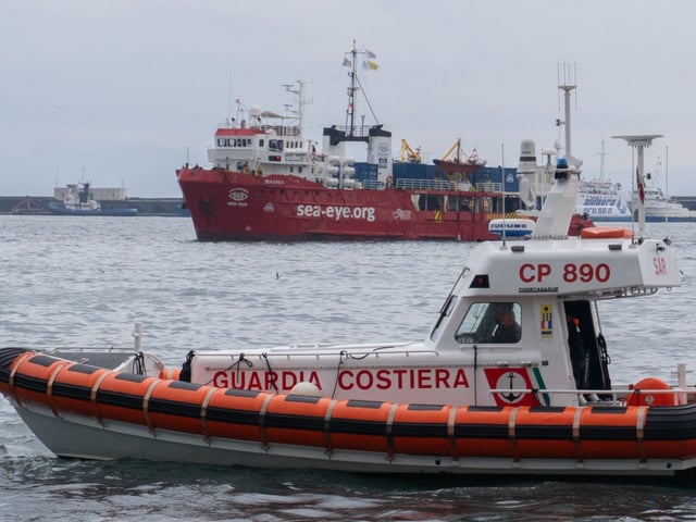 The Sea Eye 4 ship carries 41 migrants rescued in the Mediterranean Sea during the joint mission between Sea Eye, Sea Watch, and Mediterranea Saving Humans and arrives in the port of Naples, Italy, on Tuesday morning. Activists from the Mediterranea Saving Humans organization, including president Laura Marmorale and mission leader Luca Casarini, welcome the ship on the quay. (Photo by Paolo Manzo/NurPhoto via Getty Images)
