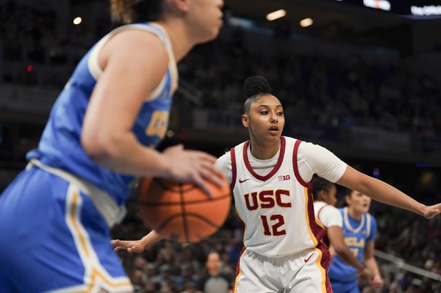 Mar 8, 2025; Indianapolis, IN, USA; USC Trojans guard JuJu Watkins (12) looks towards an open teammate as UCLA Bruins guard Kiki Rice (1) looks to pass the ball during the first quarter for the Big Ten Conference Championship at Gainbridge Fieldhouse. Mandatory Credit: Stephanie Amador Blondet-Imagn Images/File Photo