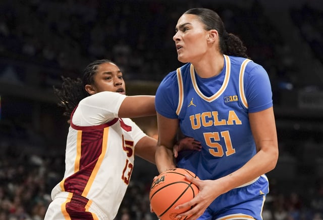 Mar 8, 2025; Indianapolis, IN, USA; UCLA Bruins center Lauren Betts (51) goes to do a layup against USC Trojans center Rayah Marshall’s (13) defense during the first quarter for the Big Ten Conference Championship at Gainbridge Fieldhouse. Mandatory Credit: Stephanie Amador Blondet-Imagn Images/File Photo