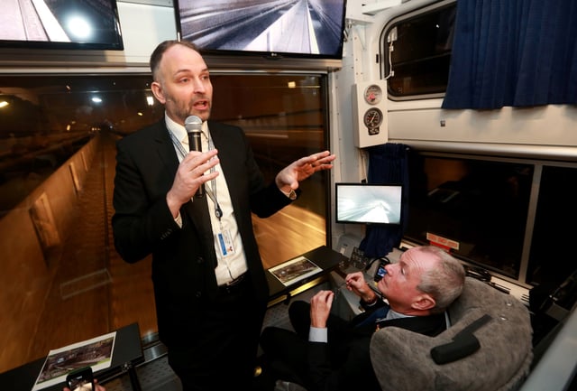 Amtrak's Stephen Gardner (L) speaks to New Jersey Governor Phil Murphy (R) and members of a state Congressional delegation during a tour of the Gateway Project through the North River Tunnel beneath the Hudson River, in Weehawken, New Jersey, U.S., January, 28, 2019.   Ed Murray/N.J. Advance Media/Pool via REUTERS/File Photo