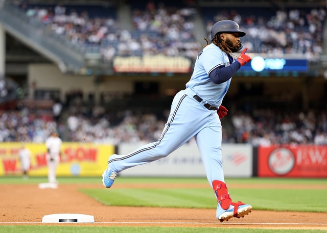 NEW YORK, NEW YORK - APRIL 21: Vladimir Guerrero Jr. #27 of the Toronto Blue Jays celebrates as he rounds third base after he hit a two run home run in the first inning against the New York Yankees at Yankee Stadium on April 21, 2023 in the Bronx borough of New York City.