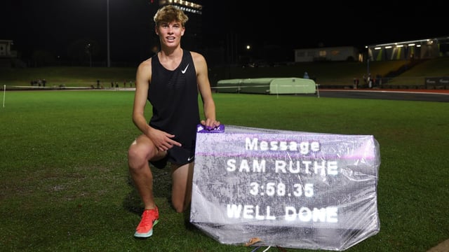Ruthe, 15, poses with his time of 3min 58.35sec, making him the youngest person to break the four-minute mile barrier, first achieved by Bannister in 1954