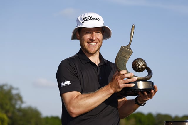 PALM HARBOR, FLORIDA - MARCH 24: Peter Malnati of the United States poses with the Valspar Championship Trophy after the final round of the Valspar Championship at Copperhead Course at Innisbrook Resort and Golf Club on March 24, 2024 in Palm Harbor, Florida.