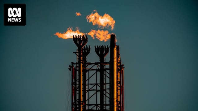 Chimneys from Scarborough's Pluto gas facility with flames coming from them.