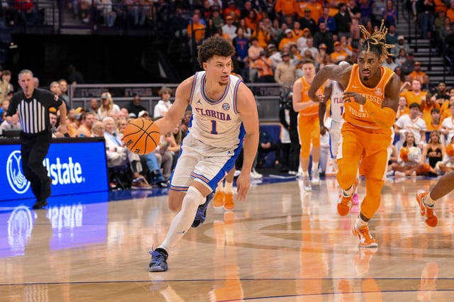 Florida Gators guard Walter Clayton Jr. brings the ball up court against the Tennessee Volunteers during the second half at the 2025 SEC Championship Game.