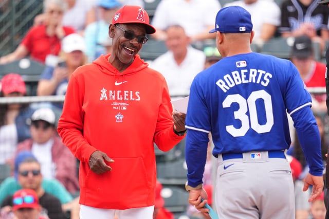 Manager Ron Washington(L) of the Los Angeles Angels smiles against the Los Angeles Dodgers during a spring training game at the Peoria Sports Complex on February 24, 2024 in Tempe, Arizona.