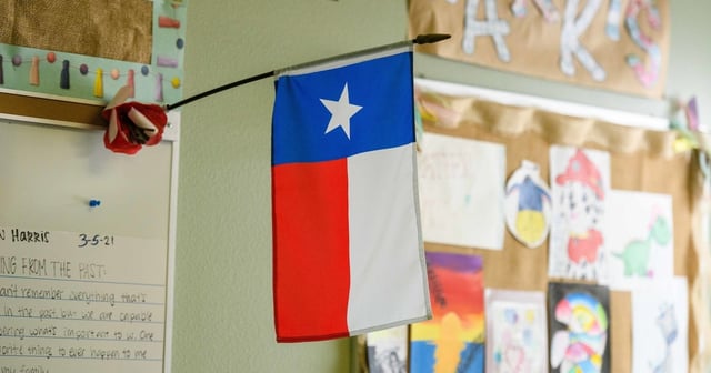 The Texas flags hangs at a classroom, on Aug. 7, 2024.