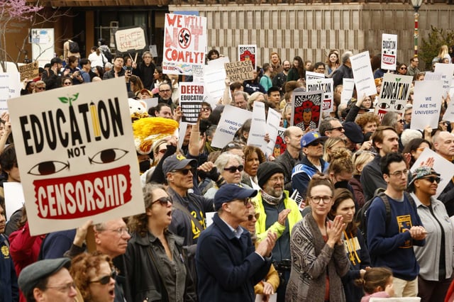 Protesters gather Wednesday at UC Berkeley to protest threats by the Trump administration.