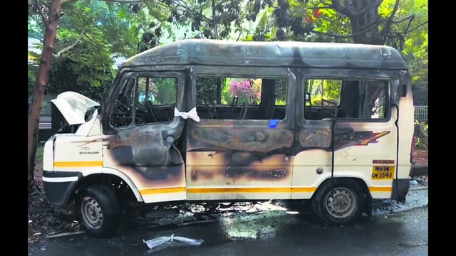 Charred remains of a tempo traveller that caught fire while it was ferrying some employees of a company to their office, at Hinjewadi, near Pune, Wednesday. (PTI)