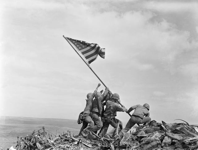 FILE - U.S. Marines of the 28th Regiment, 5th Division, raise a U.S. flag atop Mount Suribachi, Iwo Jima, Japan, Feb. 23, 1945. (AP Photo/Joe Rosenthal, File)