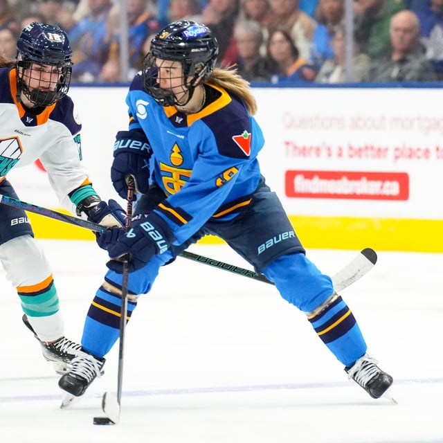 Toronto Sceptres' Daryl Watts, right, takes the puck past New York Sirens' Chloe Aurar during second period PWHL hockey action in Toronto, on Wednesday, March 19, 2025. THE CANADIAN PRESS/Chris Young