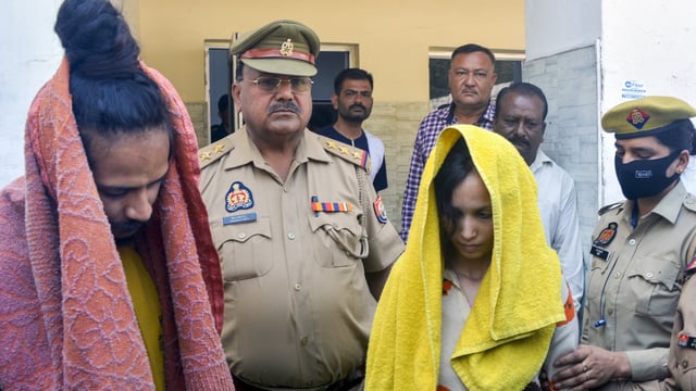 Police take away merchant navy officer Saurabh Rajput's wife Muskaan and her lover Sahil Shukla after they were arrested in connection with his murder, in Meerut, on Wednesday, 