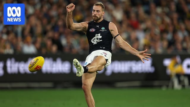 Harry McKay kicks the footy