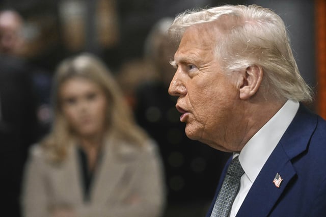 President Donald Trump talks with reporters as he visits the John F. Kennedy Center for the Performing Arts in Washington, Monday, March 17, 2025.