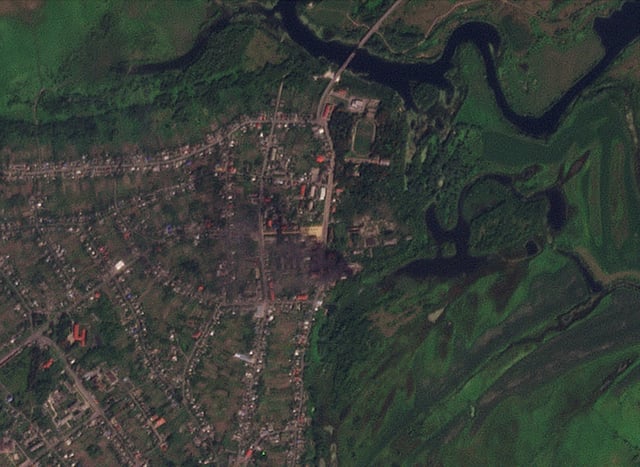 View of smoke rising from buildings that were purportedly struck by Ukrainian forces, amid their ongoing incursion, in Glushkovo, Kursk region, Russia August 21, 2024 in this satellite image. 2024 Planet Labs Inc/Handout via REUTERS/File Photo