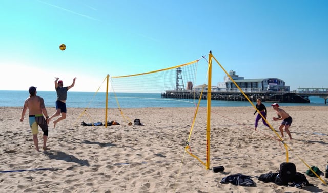 People play volleyball on Bournemouth Beach in Dorset (Photo: Andrew Matthews/PA)