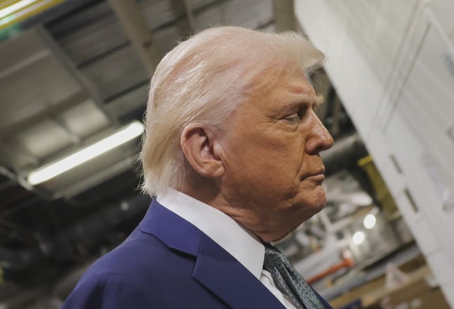 President Donald Trump talks with reporters as he visits the John F. Kennedy Center for the Performing Arts in Washington, Monday, March 17, 2025.