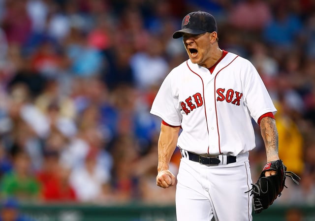 Jake Peavy #44 of the Boston Red Sox reacts after giving up a two-run home run in the fourth inning against the Chicago Cubs during the interleague game at Fenway Park on June 30, 2014 in Boston, Massachusetts.