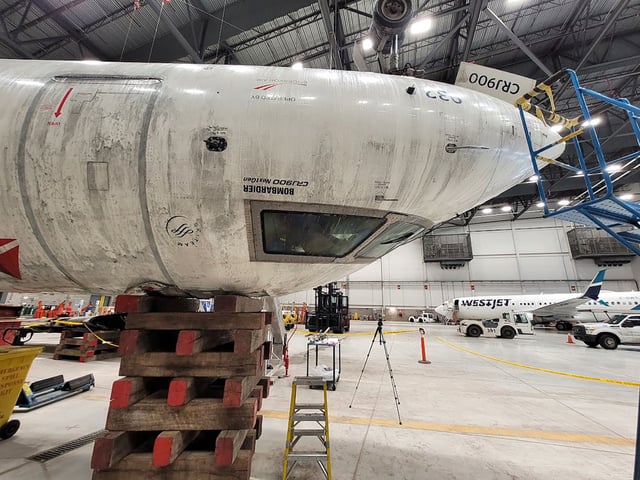 Photos show the investigation into the crash of Delta Connection (Endeavor Air) #CRJ900 at Toronto Pearson Airport, in Mississauga Canada.