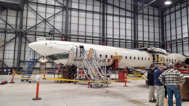 Photos show the investigation into the crash of Delta Connection (Endeavor Air) CRJ-900 at Toronto Pearson Airport, in Mississauga Canada.