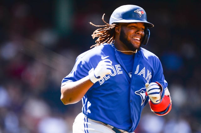 BOSTON, MA - JUNE 13: Vladimir Guerrero Jr. #27 of the Toronto Blue Jays celebrates after hitting a two-run home run in the seventh inning against the Boston Red Sox at Fenway Park on June 13, 2021 in Boston, Massachusetts.