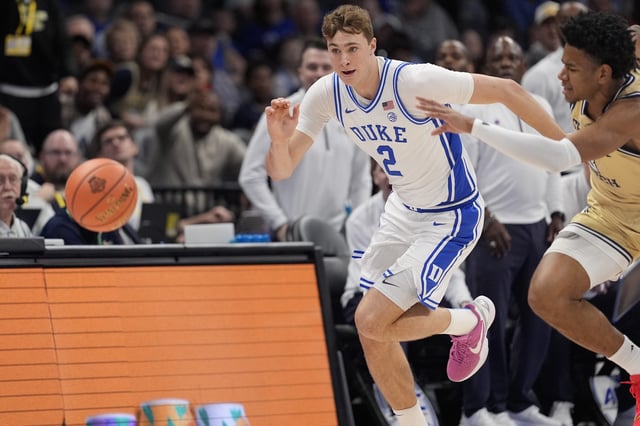 Mar 13, 2025; Charlotte, NC, USA;  Duke Blue Devils forward Cooper Flagg (2) and Georgia Tech Yellow Jackets guard Jaeden Mustaf (3) chase the loose ball during the first half at Spectrum Center. Mandatory Credit: Jim Dedmon-Imagn Images/ File Photo