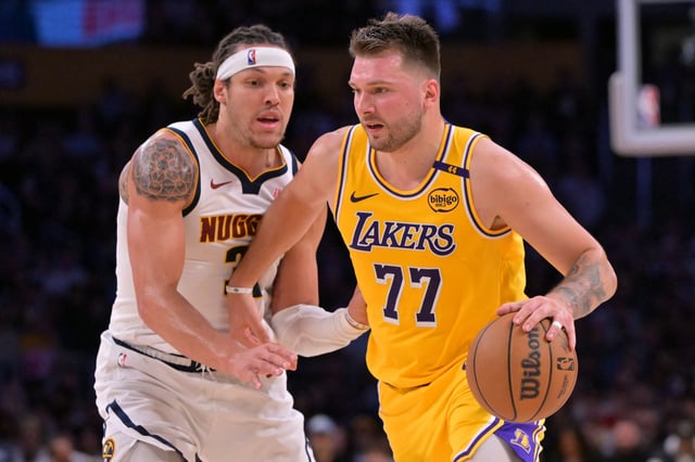 Mar 19, 2025; Los Angeles, California, USA;  Los Angeles Lakers guard Luka Doncic (77) is guarded by Denver Nuggets forward Aaron Gordon (32) in the first half at Crypto.com Arena. Mandatory Credit: Jayne Kamin-Oncea-Imagn Images/ File Photo