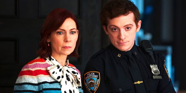 Carrie Preston and Ethan Slater stand side by side and look off screen 