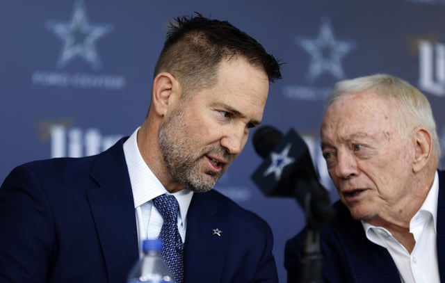 New head coach of the Dallas Cowboys Brian Schottenheimer talks with team owner Jerry Jones before a press conference at The Star in Frisco.