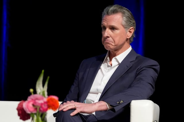 FILE – California Gov. Gavin Newsom holds a fireside chat with Stephen Cheung, the President and Chief Executive Officer of the Los Angeles County Economic Development Corporation (LAEDC) and its subsidiary, the World Trade Center Los Angeles (WTCLA) at the 2025 Economic Forecast and Industry Outlook convening on Wednesday, Feb. 26, 2025, at the East LA College in Los Angeles. (AP Photo/Damian Dovarganes, File)