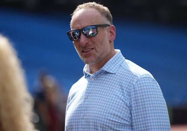 Aug 11, 2023; Toronto, Ontario, CAN; Toronto Blue Jays president and CEO Mark Shapiro talks with friends during batting practice before a game between the Chicago Cubs and the Toronto Blue Jays at Rogers Centre. Mandatory Credit: Nick Turchiaro-USA TODAY Sports/ File Photo