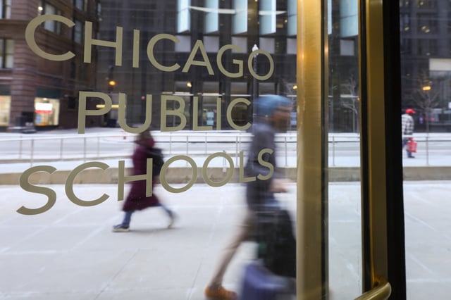 People walk past the Chicago Public Schools central office entrance on Jan. 30, 2025. (Audrey Richardson/Chicago Tribune)