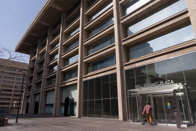 A man enters the building that houses the offices of the Institute of Museum and Library Services (IMLS), Thursday, March 20, 2025, in Washington. (AP Photo/Jacquelyn Martin)